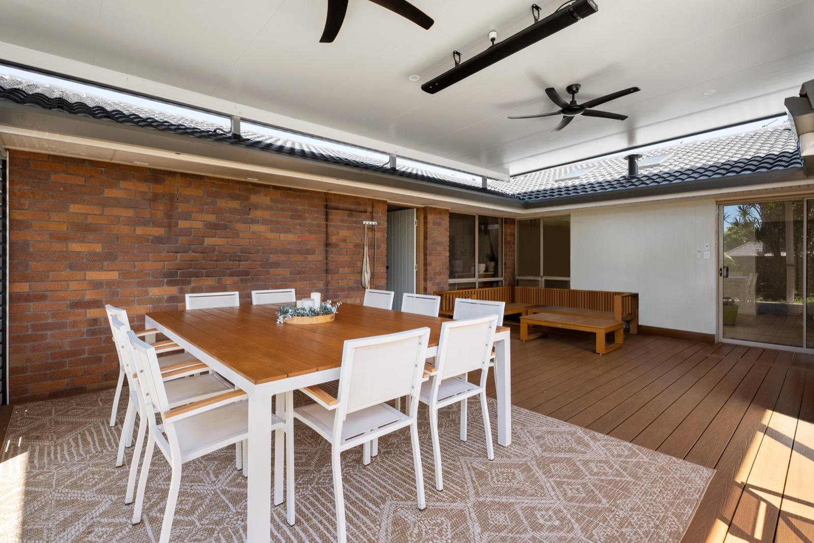 Deck patio with outdoor dining, ceiling fans and strip heaters