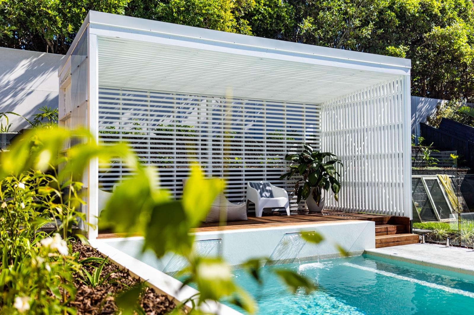 Louvred-roof cabana built beside a swimming pool